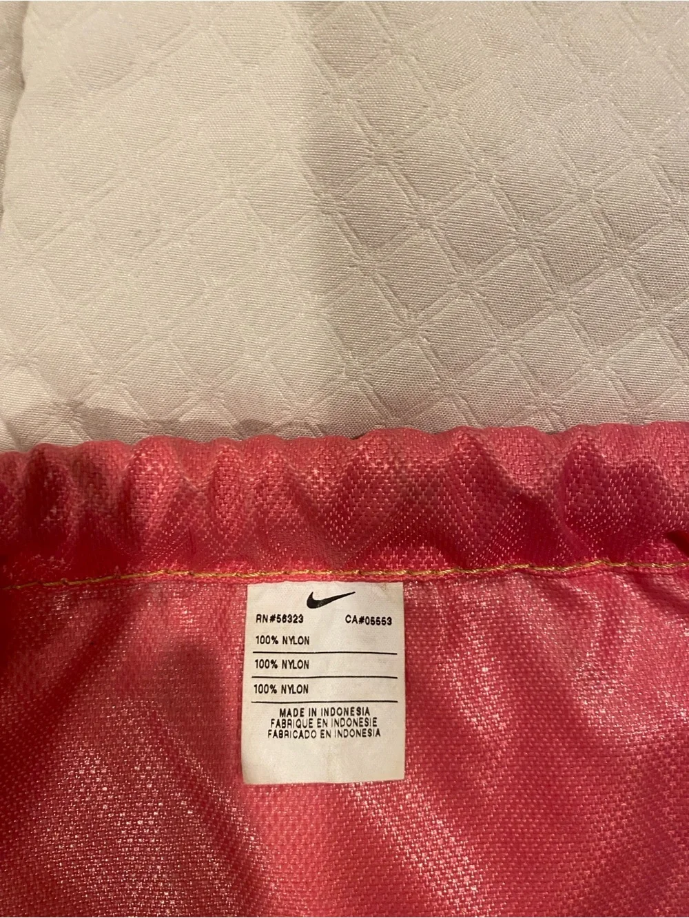 Nike Black Drawstring Backpack with Pink Logo and Lime Green Accents